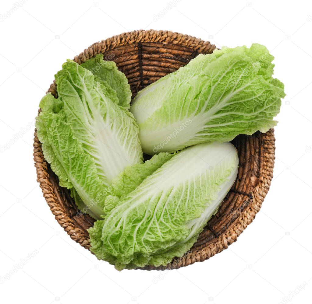 Fresh tasty Chinese cabbages in wicker basket on white background, top view