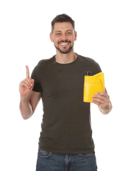Man Holding Yellow Container Motor Oil Pointing White Background — Stockfoto
