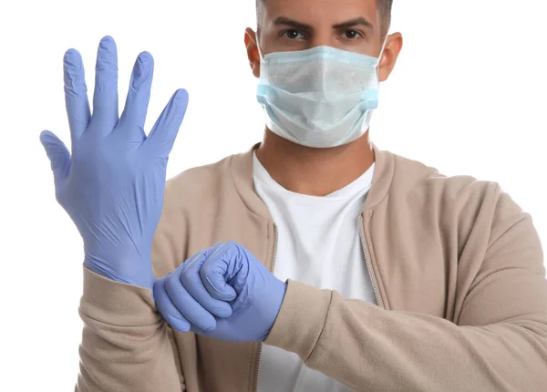 Man Protective Face Mask Putting Medical Gloves White Background Closeup — Stockfoto
