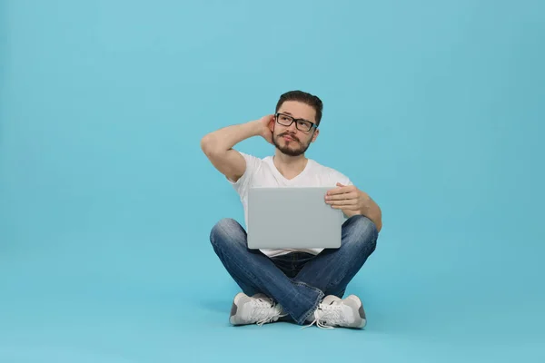 Pensive Man Sitting Using Laptop Light Blue Background — 스톡 사진