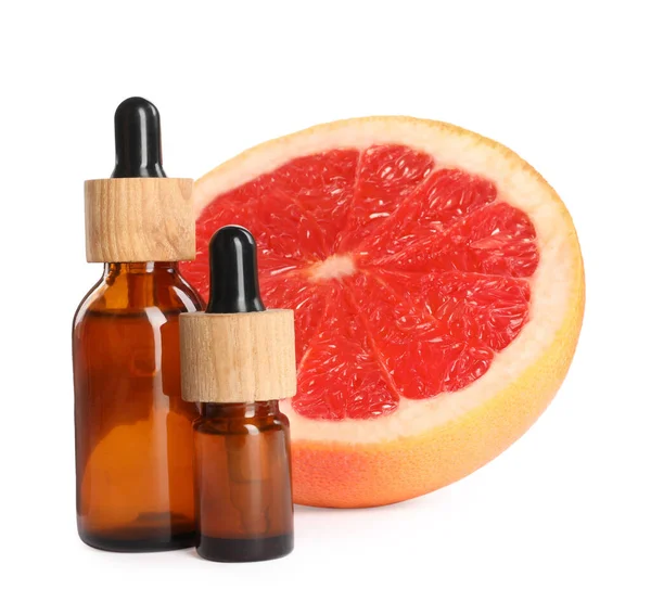 Bottles Citrus Essential Oil Fresh Grapefruit White Background — Zdjęcie stockowe