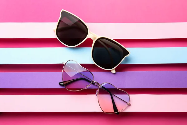 Different Stylish Sunglasses Color Background Flat Lay —  Fotos de Stock