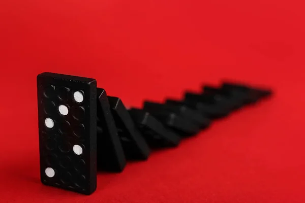 Black Domino Tiles Falling Red Background Space Text — Stock Photo, Image