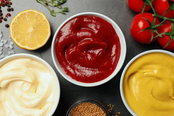 Flat Lay Composition Ketchup Mustard Mayonnaise Ingredients Grey Table — Stockfoto