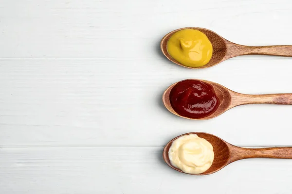 Ketchup Mayonnaise Mustard Spoons White Wooden Table Flat Lay Space — Foto de Stock