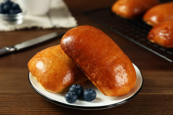 Delicious Baked Pirozhki Blueberries Wooden Table Closeup — Stockfoto