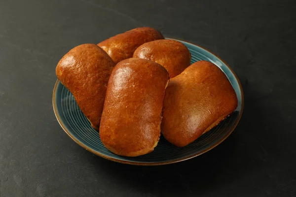 Many Delicious Baked Pirozhki Black Table — Stok fotoğraf