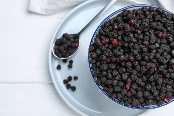 Bowl Spoon Dried Blueberries White Wooden Table Top View — Stockfoto