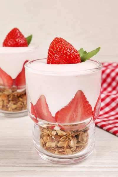 Glasses Tasty Yogurt Muesli Strawberries Served White Wooden Table — Foto de Stock