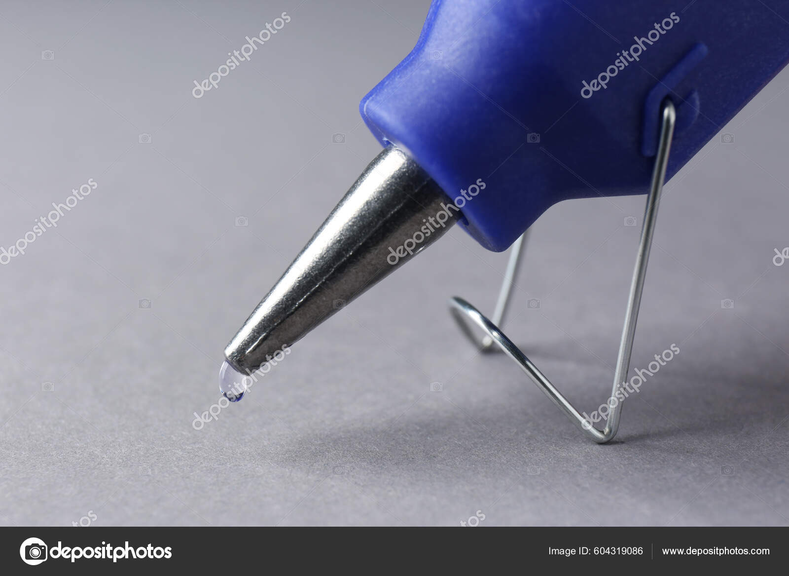 Melted Glue Dripping Out Hot Gun Nozzle Grey Background Closeup Stock Photo  by ©NewAfrica 604319086
