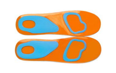 Color orthopedic insoles isolated on white, top view