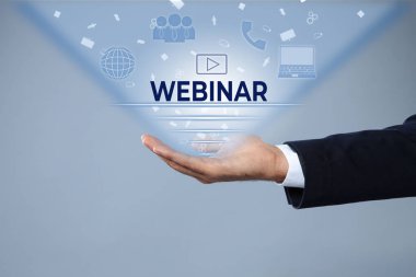 Webinar concept. Closeup view of man and different virtual icons on light grey background
