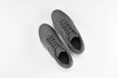 Pair of stylish sport shoes on white background, top view