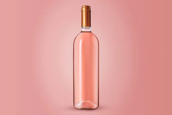 Bottle of expensive rose wine on pink background