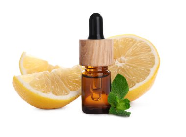Bottle of citrus essential oil and cut fresh lemon isolated on white