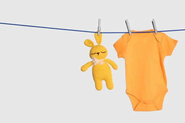 Baby Onesie Toy Bunny Drying Laundry Line Light Background — Stok fotoğraf