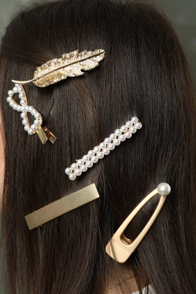 Woman with beautiful different hair clips, closeup