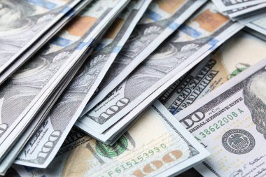 Dollar banknotes as background, closeup view. Money exchange