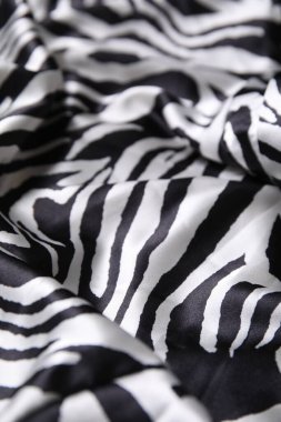 Arka plan olarak hayvan desenli güzel kumaş dokusu, yakın plan.