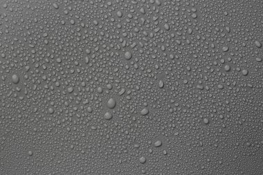 View of many water drops on grey background