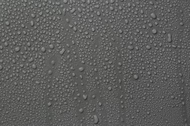 View of many water drops on grey background