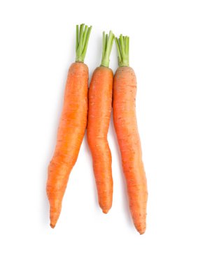Tasty ripe carrots on white background, top view