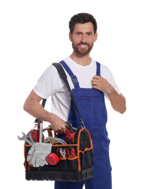 Professional plumber with tool bag on white background