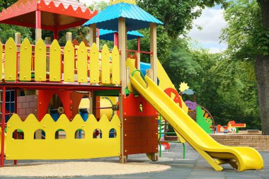 New colorful castle playhouse with slide on children's playground