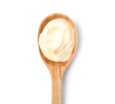 Mayonnaise in wooden spoon isolated on white, top view