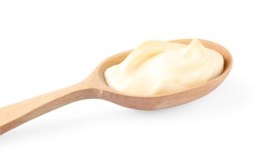 Mayonnaise in wooden spoon isolated on white, closeup