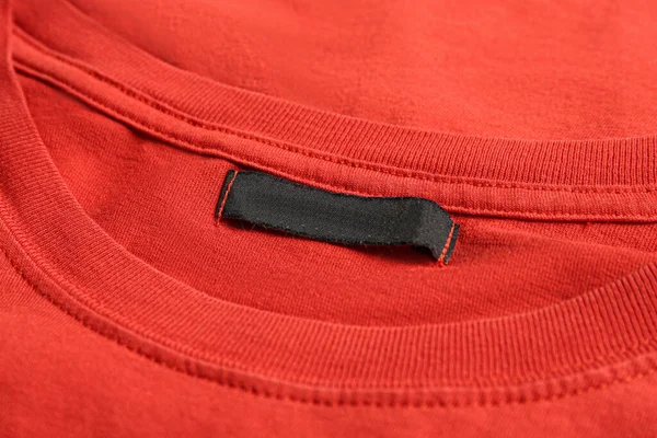Blank Clothing Label Red Shirt Closeup — Stockfoto