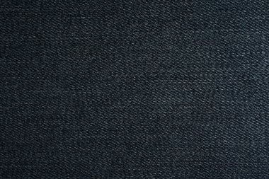 Arka plan olarak koyu mavi kotun dokusu, yakın plan