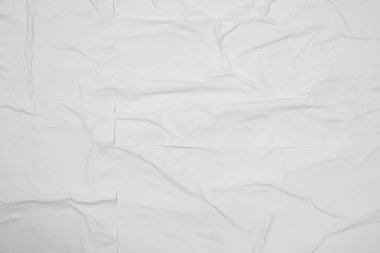 Arkaplan olarak beyaz buruşmuş posterin üst görünümü, yakın plan