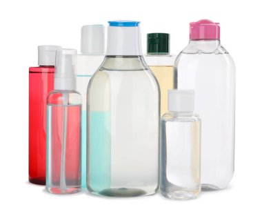 Bottles of micellar cleansing water on white background