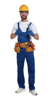 Professional builder in uniform with tool belt isolated on white