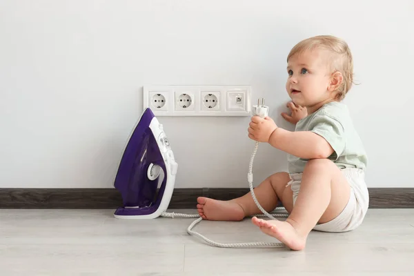 Cute Baby Playing Electrical Socket Iron Plug Home Dangerous Situation — Stok fotoğraf