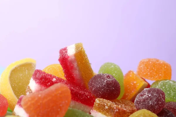 Pile Delicious Bright Jelly Candies Violet Background Closeup — Stockfoto