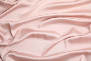 Arka plan olarak narin pembe ipeğin dokusu, üst görünüm