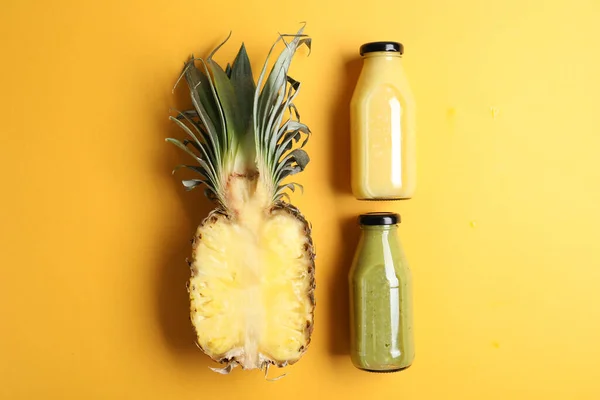Bottles Delicious Colorful Juices Cut Pineapple Yellow Background Flat Lay —  Fotos de Stock