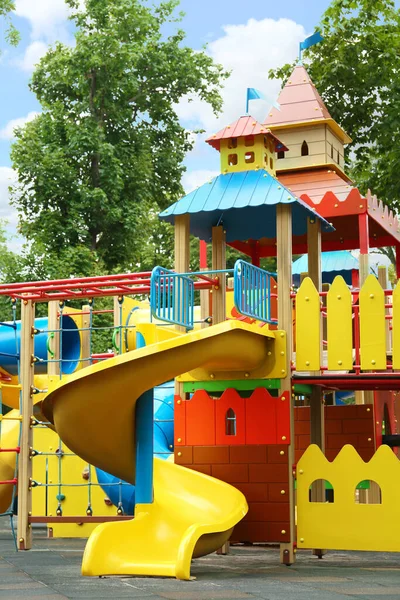 New colorful castle playhouse with slide on children's playground