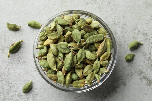 Glass Bowl Dry Cardamom Pods Light Grey Table Top View — Stok fotoğraf