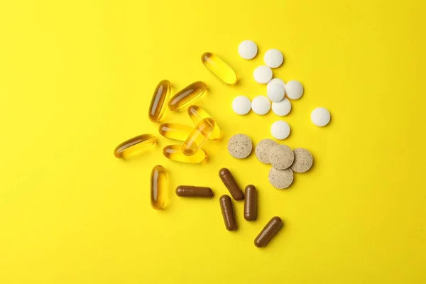 Different Dietary Supplements Yellow Background Flat Lay — Fotografia de Stock