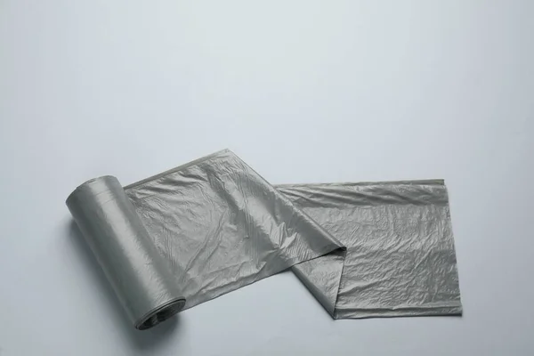 Roll Grey Garbage Bags Light Background Top View — Stok fotoğraf