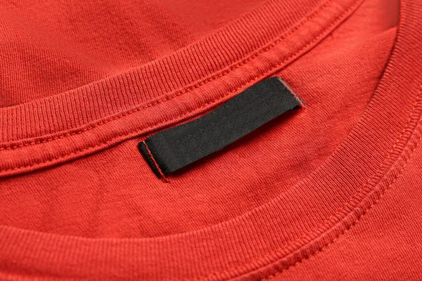 Blank Clothing Label Red Shirt Closeup — Foto Stock