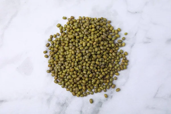 Pile Green Mung Beans White Marble Table Top View — Foto de Stock