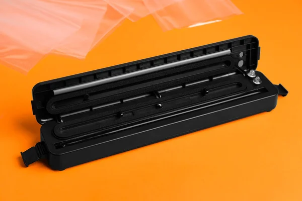 Sealer Vacuum Packing Orange Background — Stockfoto