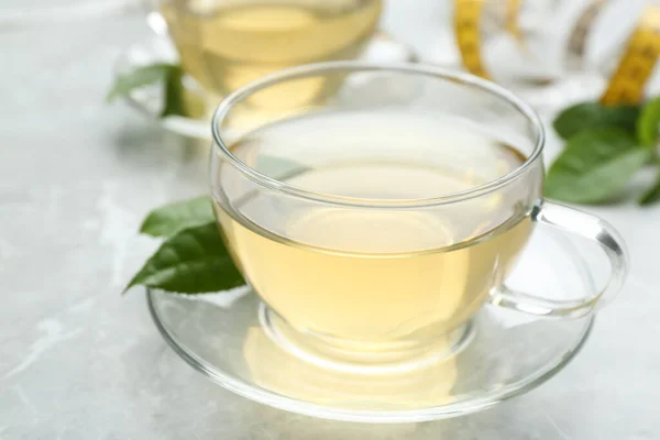 Herbal diet tea on light table, closeup