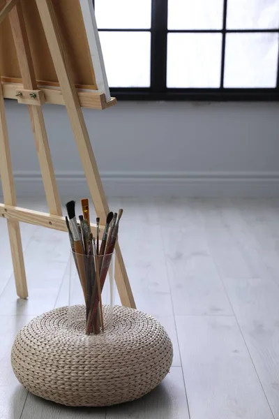 Different Brushes Wicker Pouf Easel Artist Studio Space Text — Stockfoto