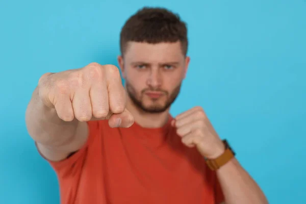 Young Man Ready Fight Light Blue Background Focus Hand Space — Stock Photo, Image