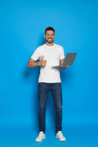 Handsome Man Laptop Showing Thumbs Light Blue Background — Stok Foto